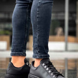 Men's black sneakers with thick ridged platform sole and lace-up design