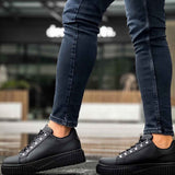 Men's black lace-up sneakers with thick platform sole and rounded toe