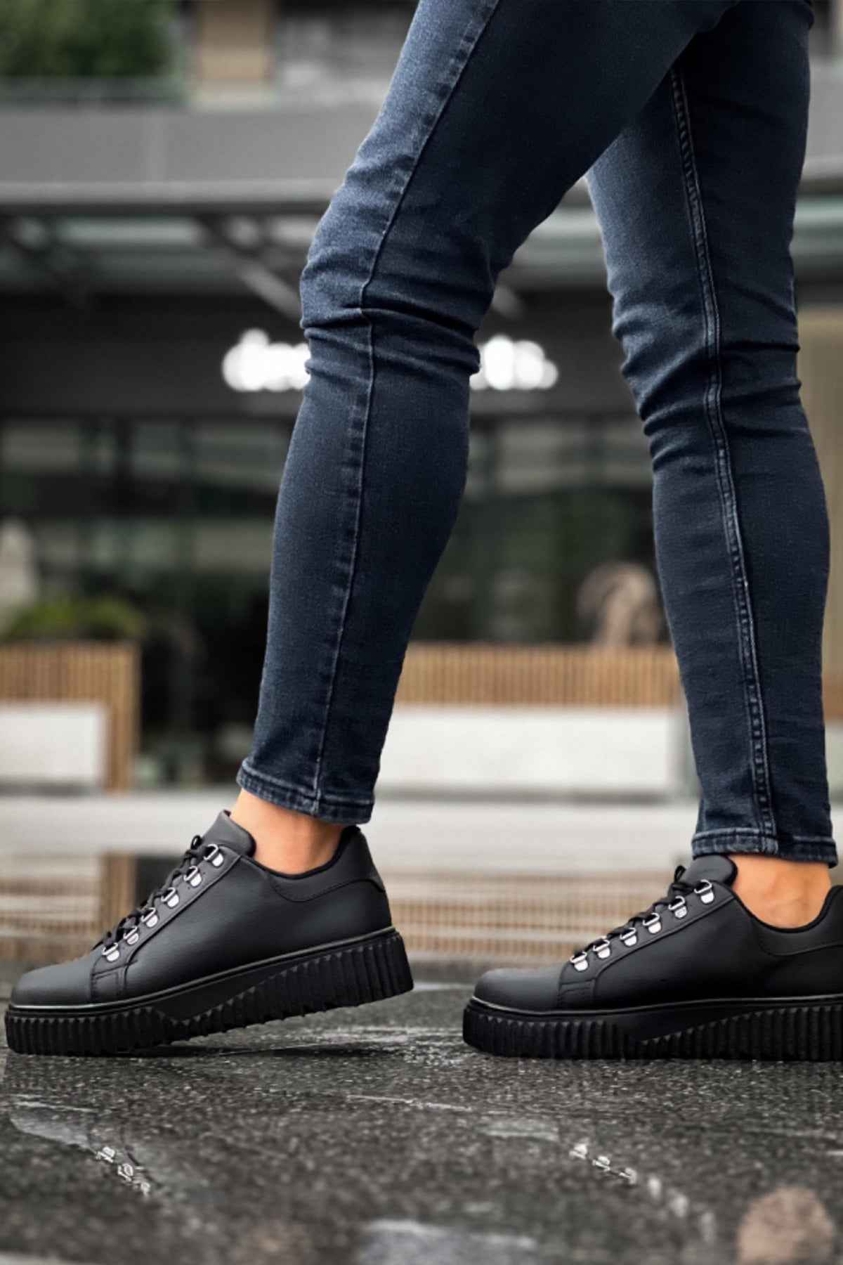 Men's black lace-up sneakers with thick platform sole and rounded toe