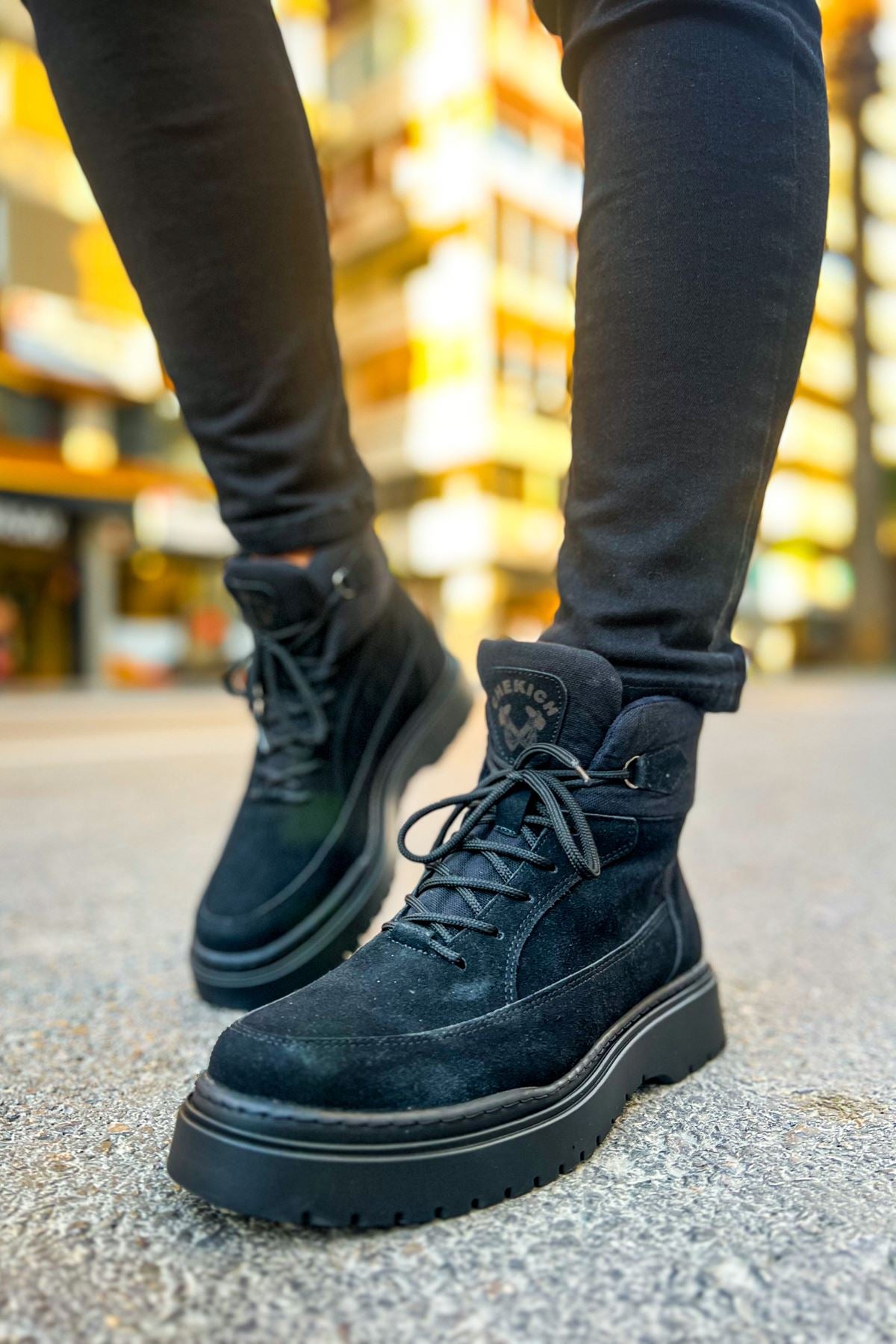 Men's dark suede lace-up ankle boots, side view with thick tread sole
