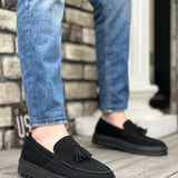 Men's black suede loafers with tassel detail and cushioned thick sole
