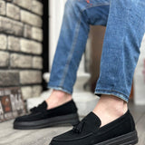 Men's black suede loafer, side view, tassel accent and grippy tread sole