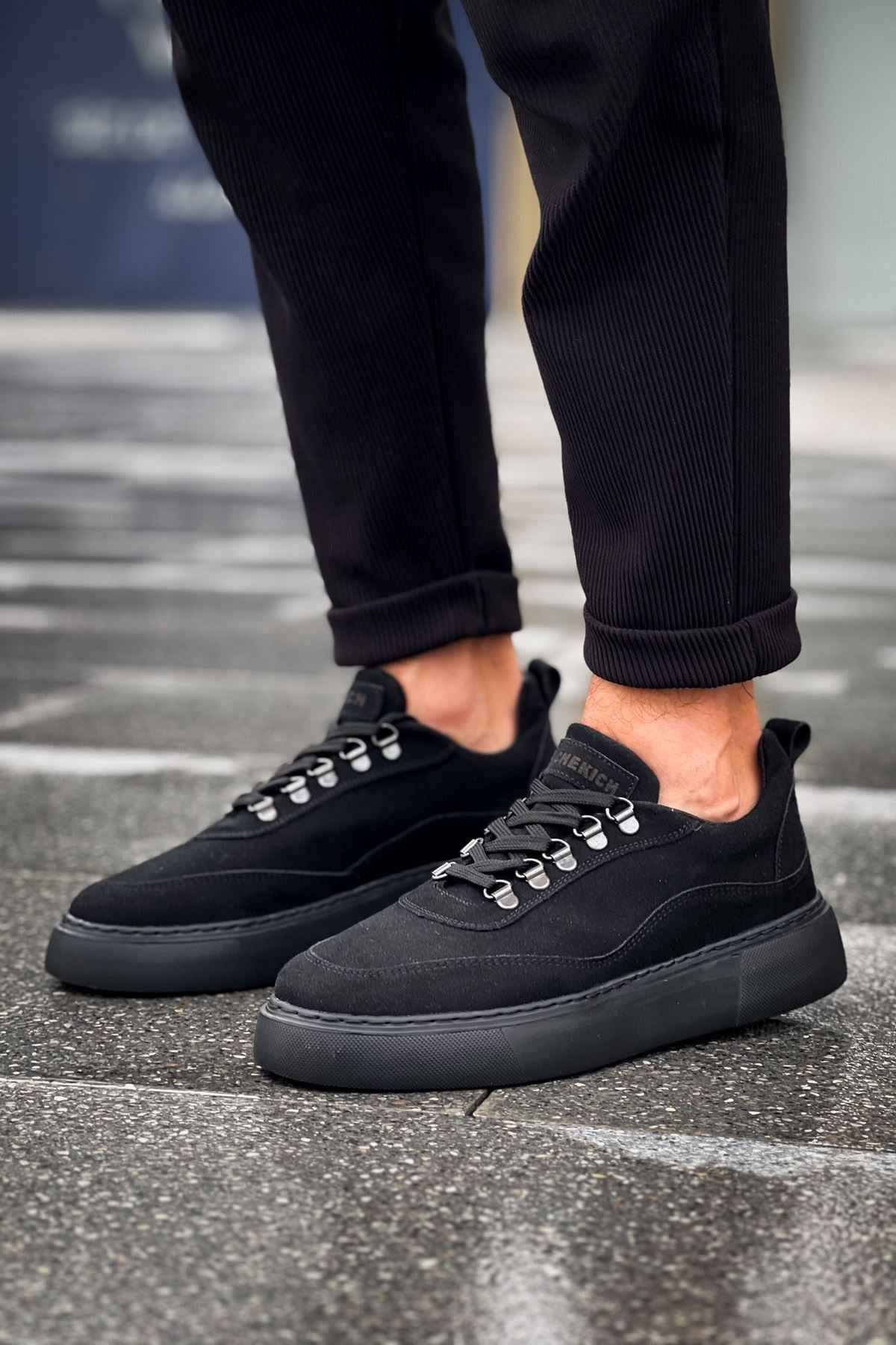 Black suede lace-up sneakers with padded collar and lace front