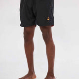 Men's black swim shorts, back view with orange waistband cord and anchor logo.
