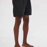 Men's black swim shorts, side view with orange drawstring and waistband trim.