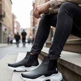 Men's black slip-on ankle boots with white chunky soles