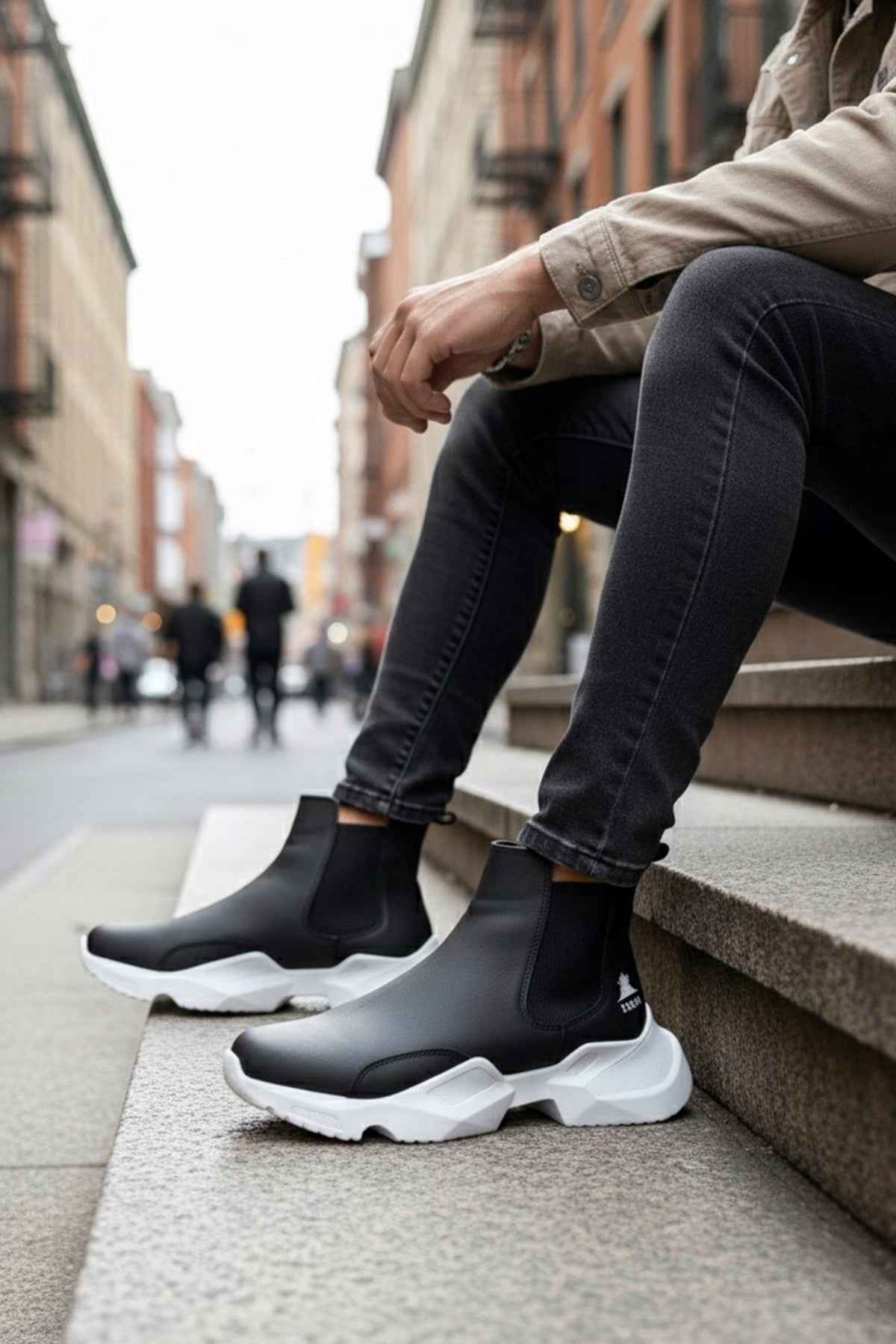 Men's black slip-on ankle boots with white chunky soles