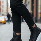 Men's black high-top boots with lace-up front and white platform sole