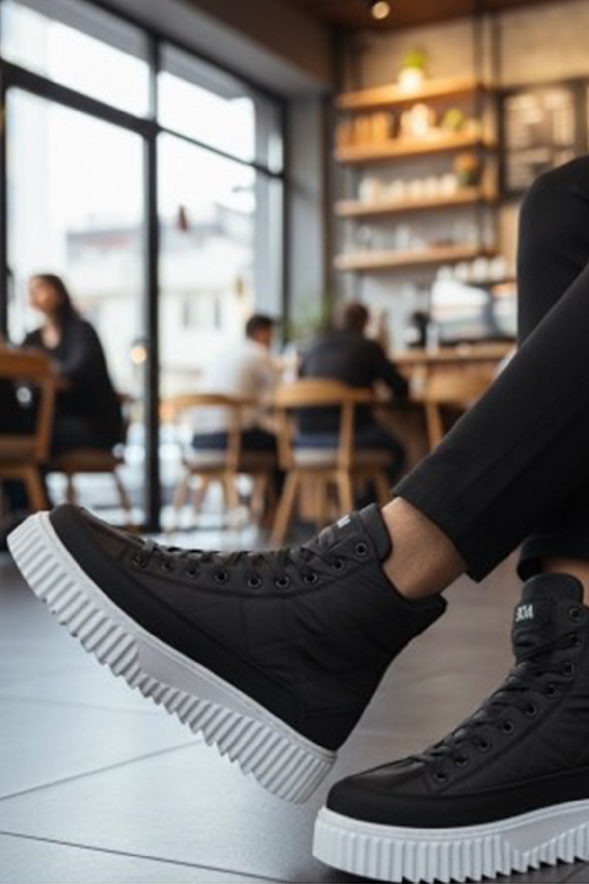 Men's black high-top lace-up boots with thick white sole