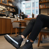 Men's black lace-up boots with white side stripe and chunky rubber sole