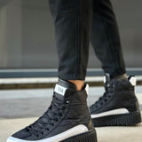 Black lace-up high-top boots with white trim and chunky platform sole