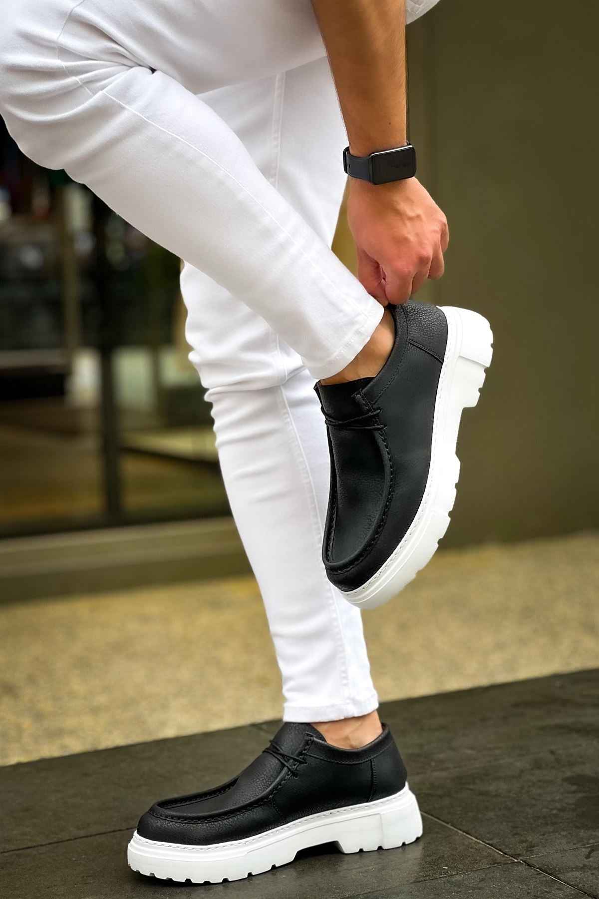 Men's black slip-on shoes with white sole, elastic gore and thick tread