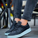 Men's black low-top sneakers with lace-up closure and white rubber sole