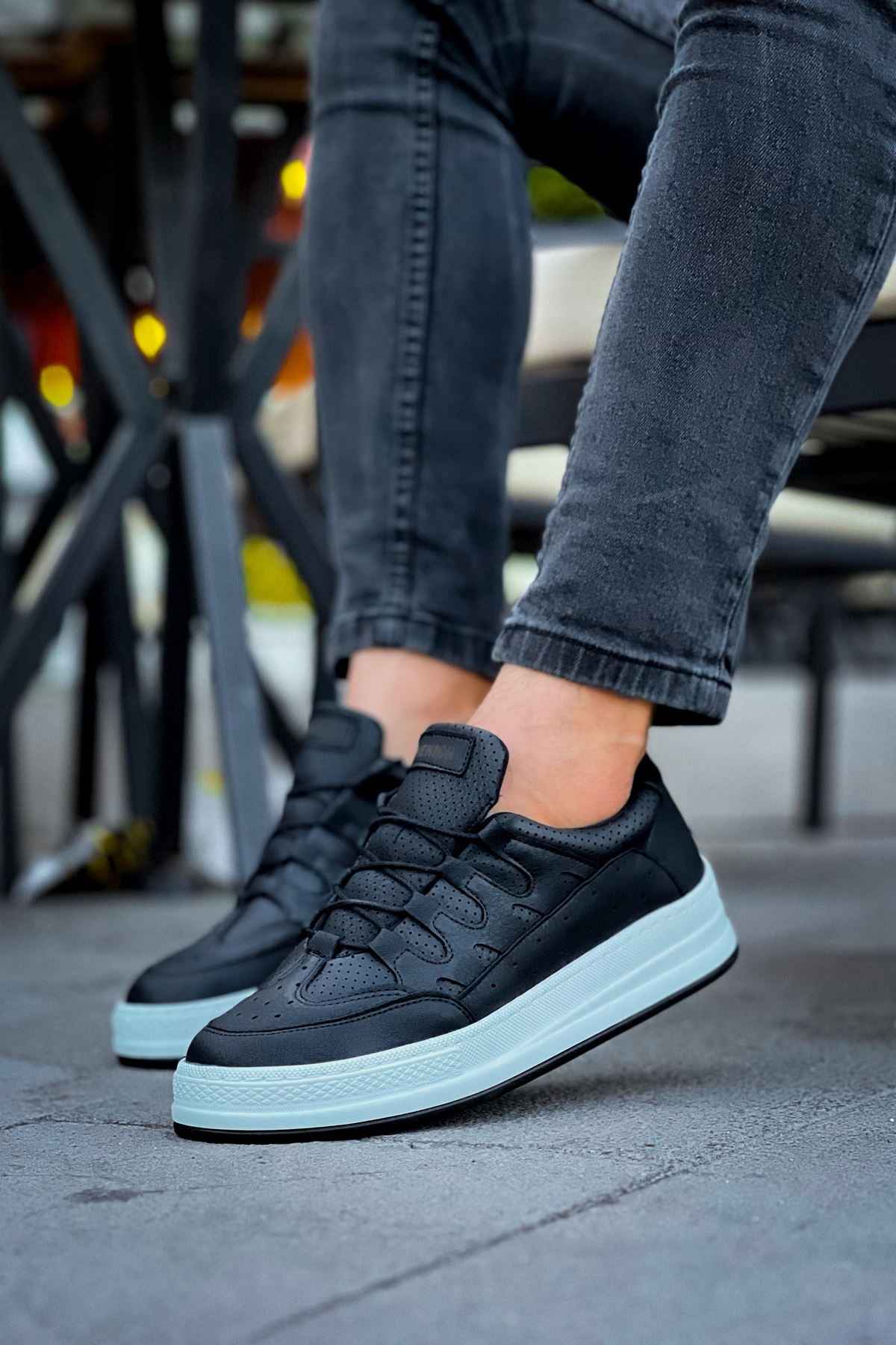 Men's black low-top sneakers with lace-up closure and white rubber sole