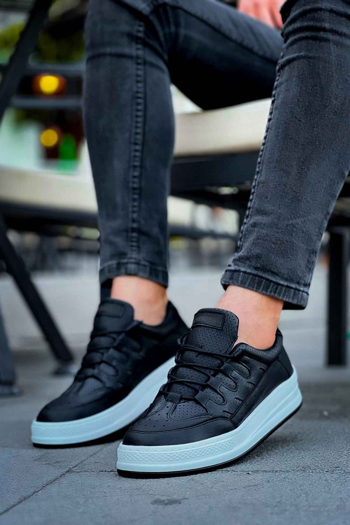 Men's black lace-up sneakers with white sidewall sole and strap detail