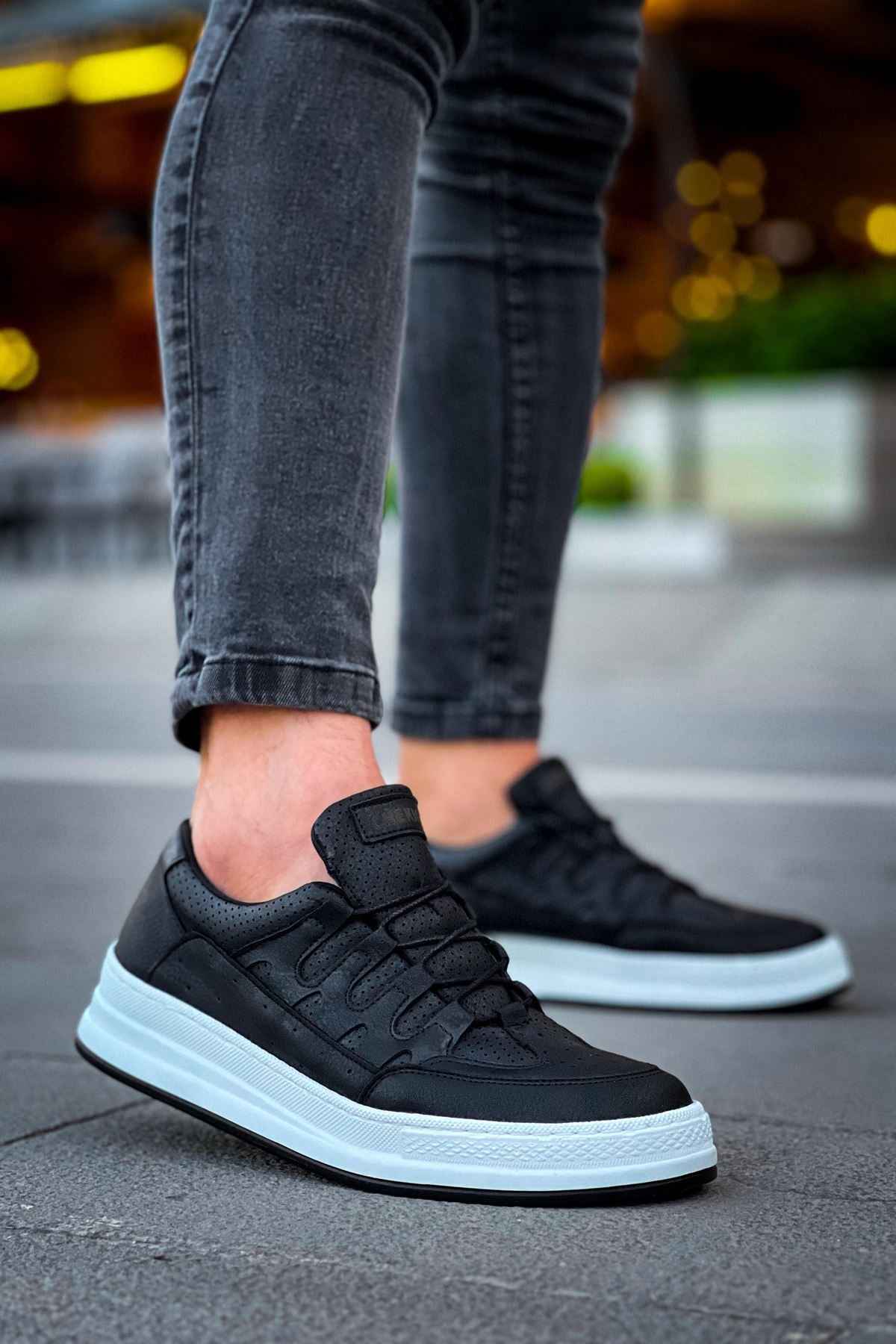 Men's black lace-up sneakers with white rubber sole and stitched panel detail