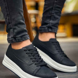 Black lace-up sneakers with white sole, side profile view