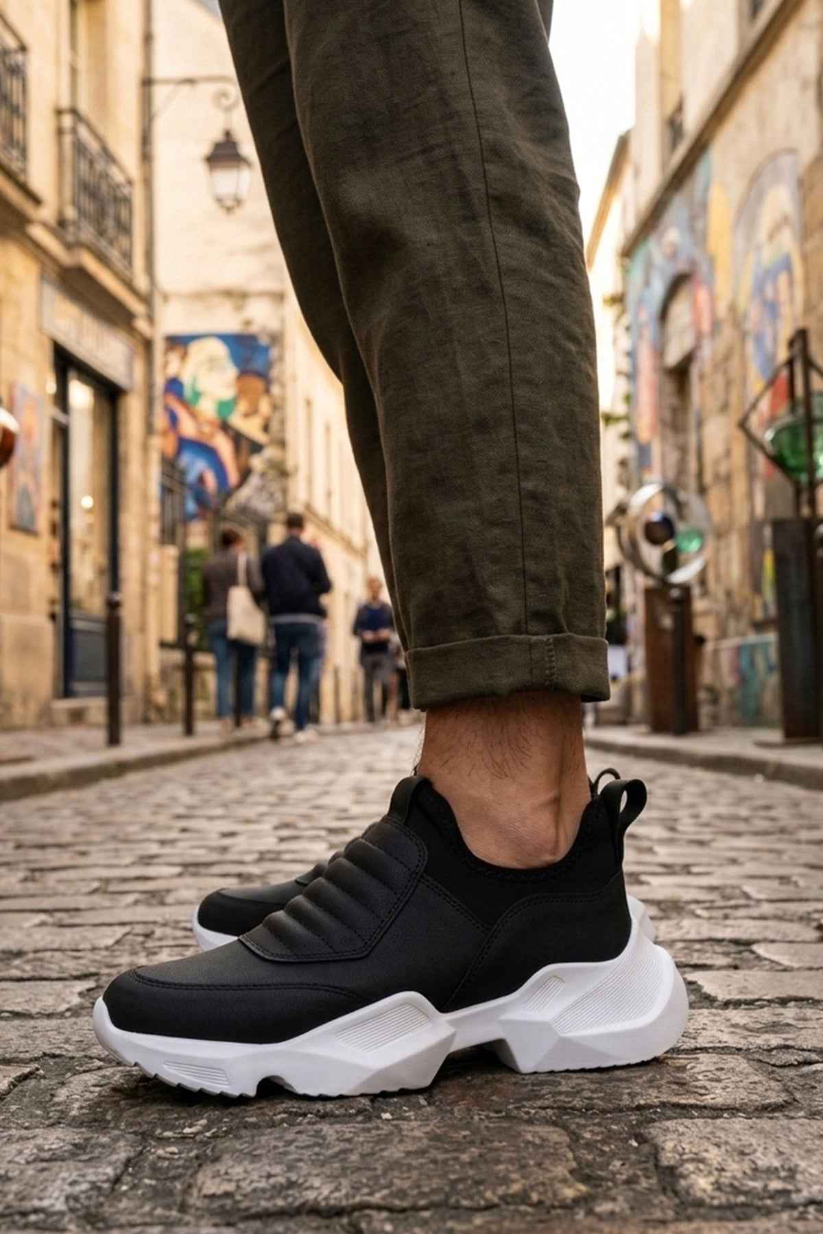 Men's black sneakers with white chunky sole and quilted strap detailing