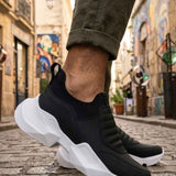 Men's black sneakers with white chunky sole and textured side panel