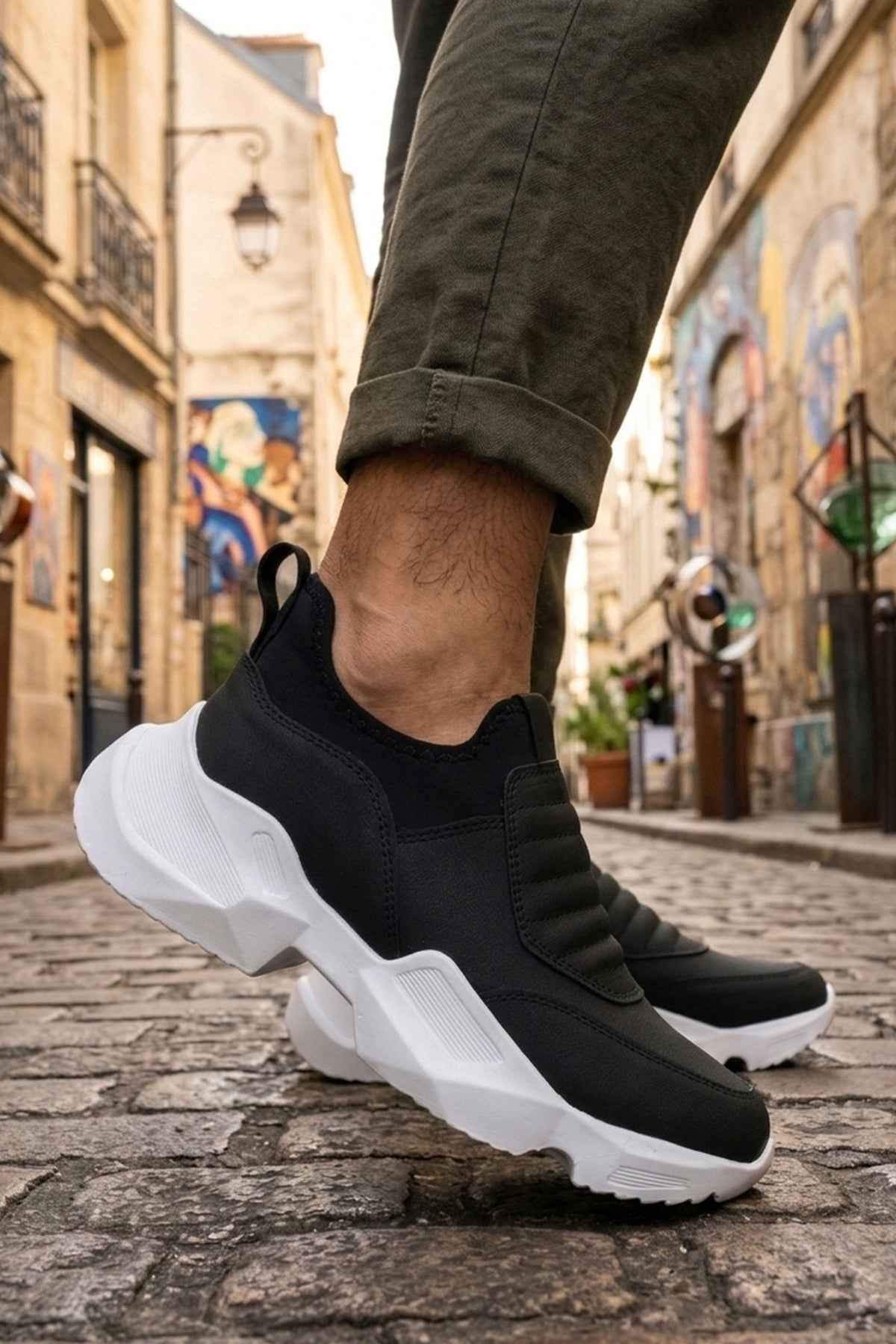 Men's black sneakers with white chunky sole and textured side panel
