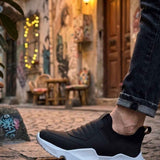 Men's black sneakers with white chunky sole and cushioned upper