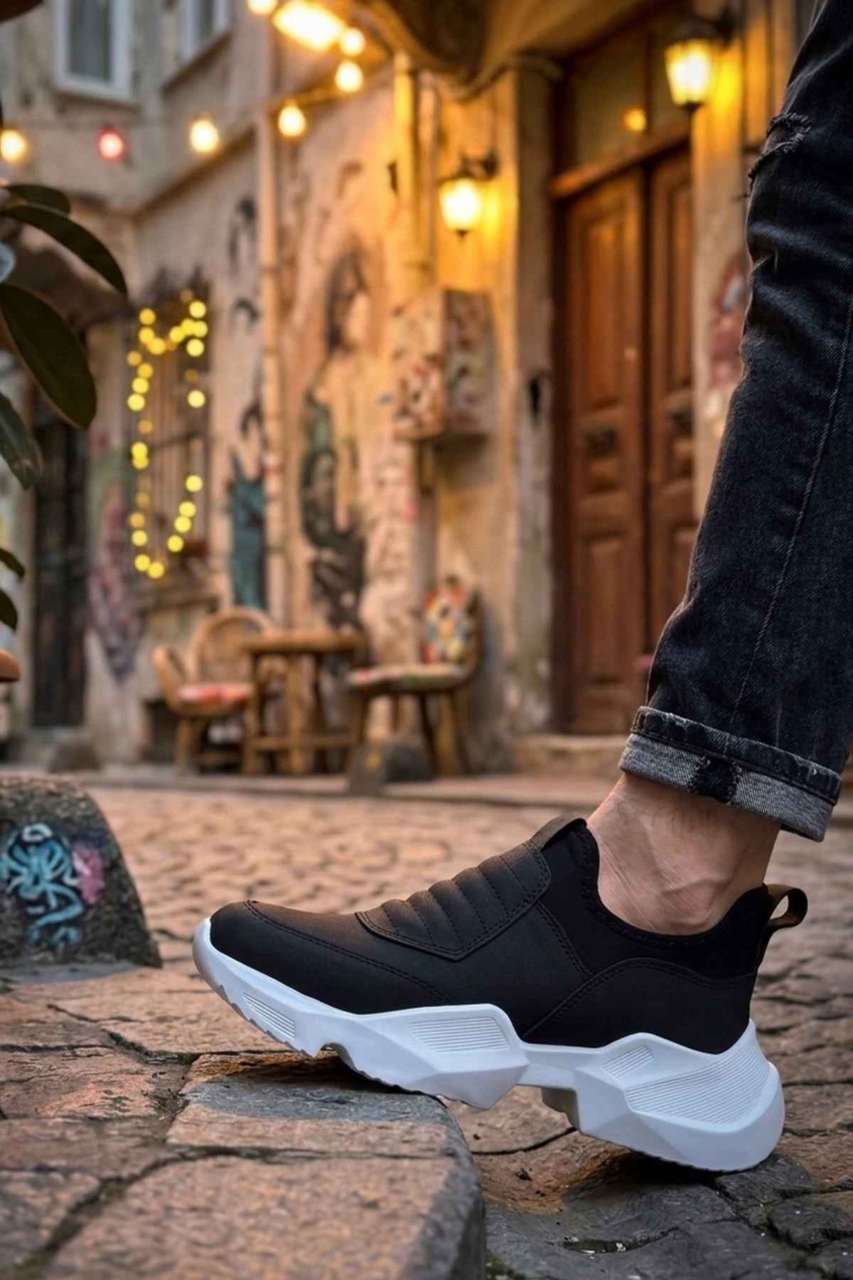 Men's black sneakers with white chunky sole and cushioned upper