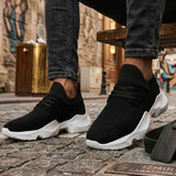 Men's black knit lace-up sneakers with white sole, angled front side view