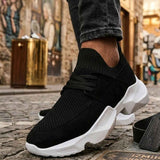 Men's black knit lace-up sneakers with white chunky sole, side view