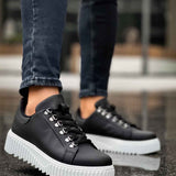 Men's black sneakers with thick white platform sole and lace-up front