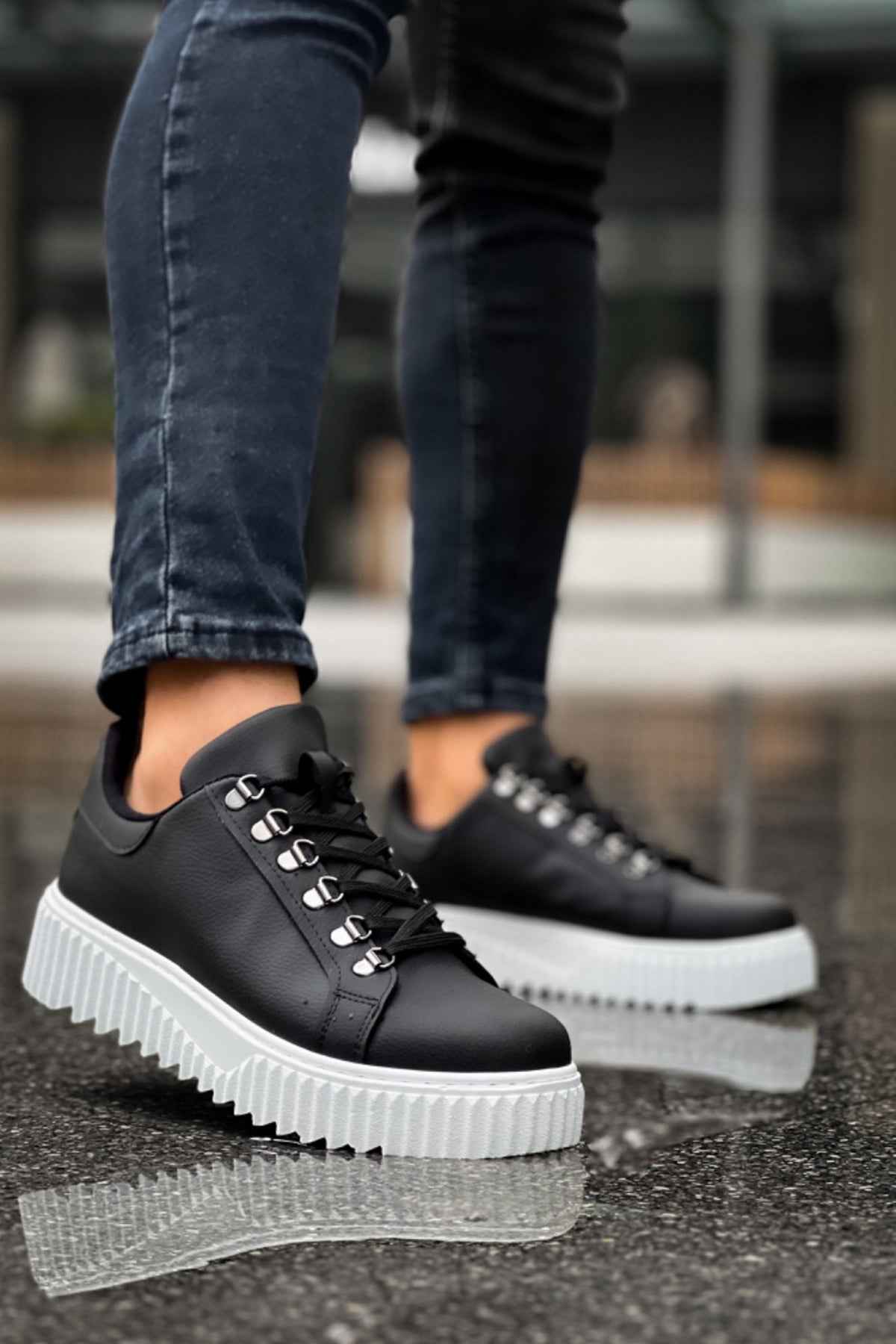 Men's black sneakers with thick white platform sole and lace-up front