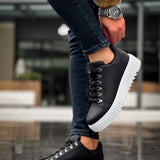Men's black sneakers with white platform sole and lace-up eyelets, side angle