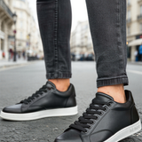 Men's black leather lace-up sneakers with white rubber sole