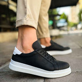 Men's black lace-up sneakers with white midsole and textured side panels