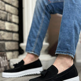 Men's black suede slip-on loafers with tassel fringe and white platform sole