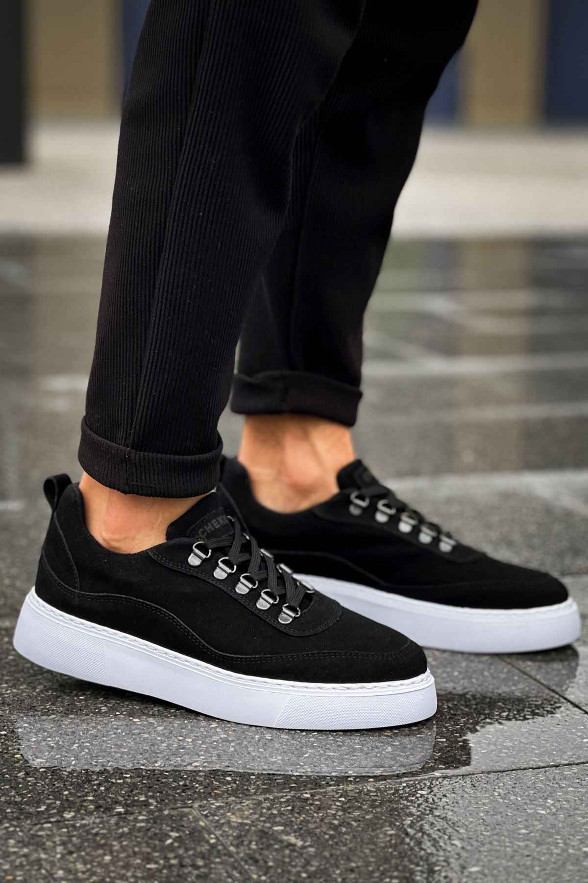 Men's black suede lace-up sneakers with white sole, angled side view
