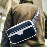Men's tablet bag with navy and white panels, front zipper pocket and shoulder strap