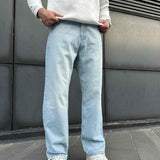 Light blue baggy jeans with relaxed straight legs and cuffed hems
