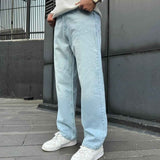 Light blue baggy jeans with wide legs, front creases, and side pockets