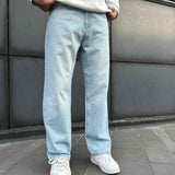Light blue baggy jeans with relaxed fit, visible stitching, and cuffed ankle hems