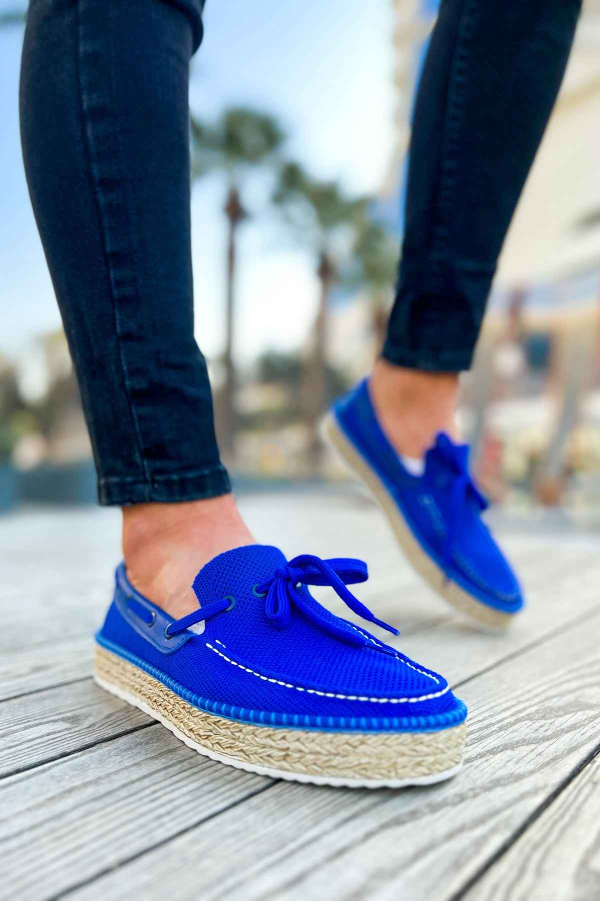 Blue lace-up espadrille boat shoes with stitched detail and jute-wrapped sole