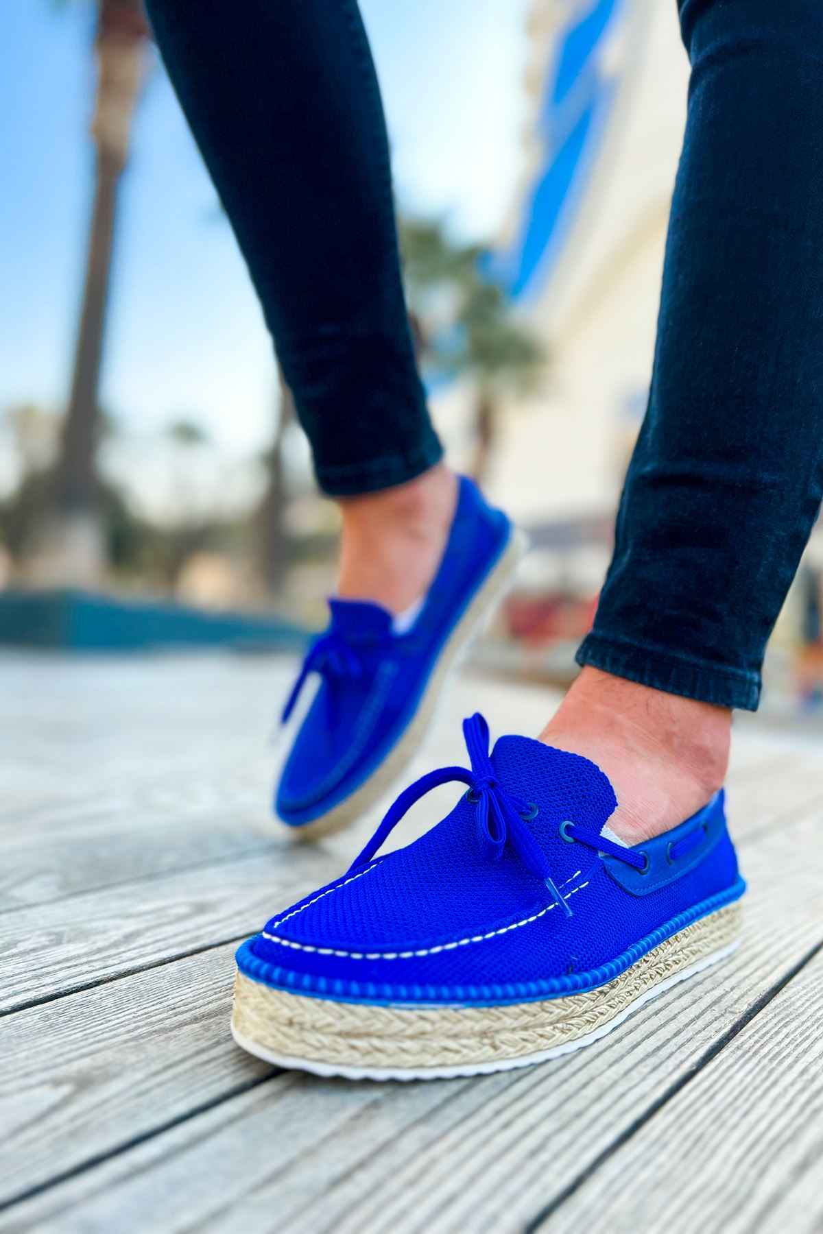 Blue espadrille boat shoes with lace-up ties and textured jute-wrapped sole