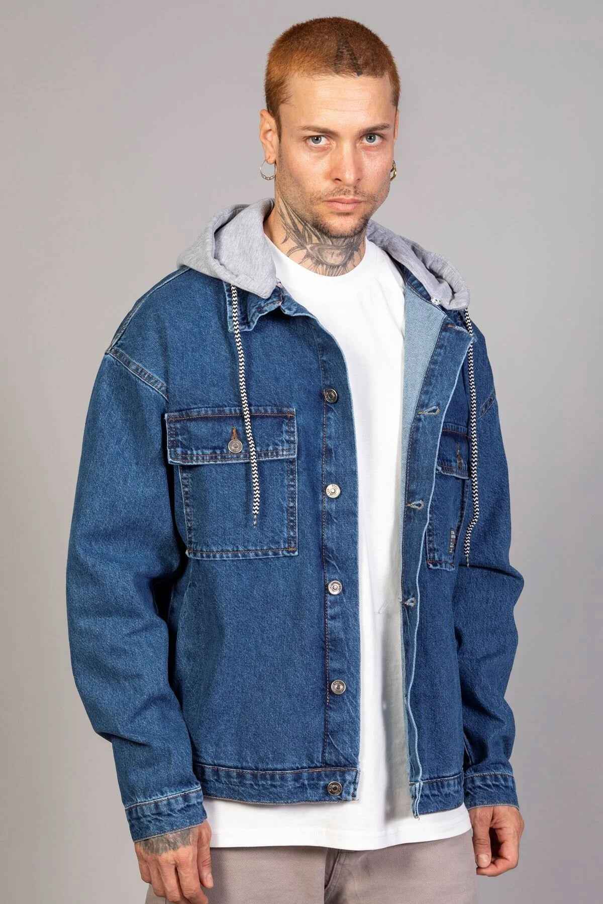 Men's blue oversized denim jacket with gray hoodie lining, button front and chest pocket