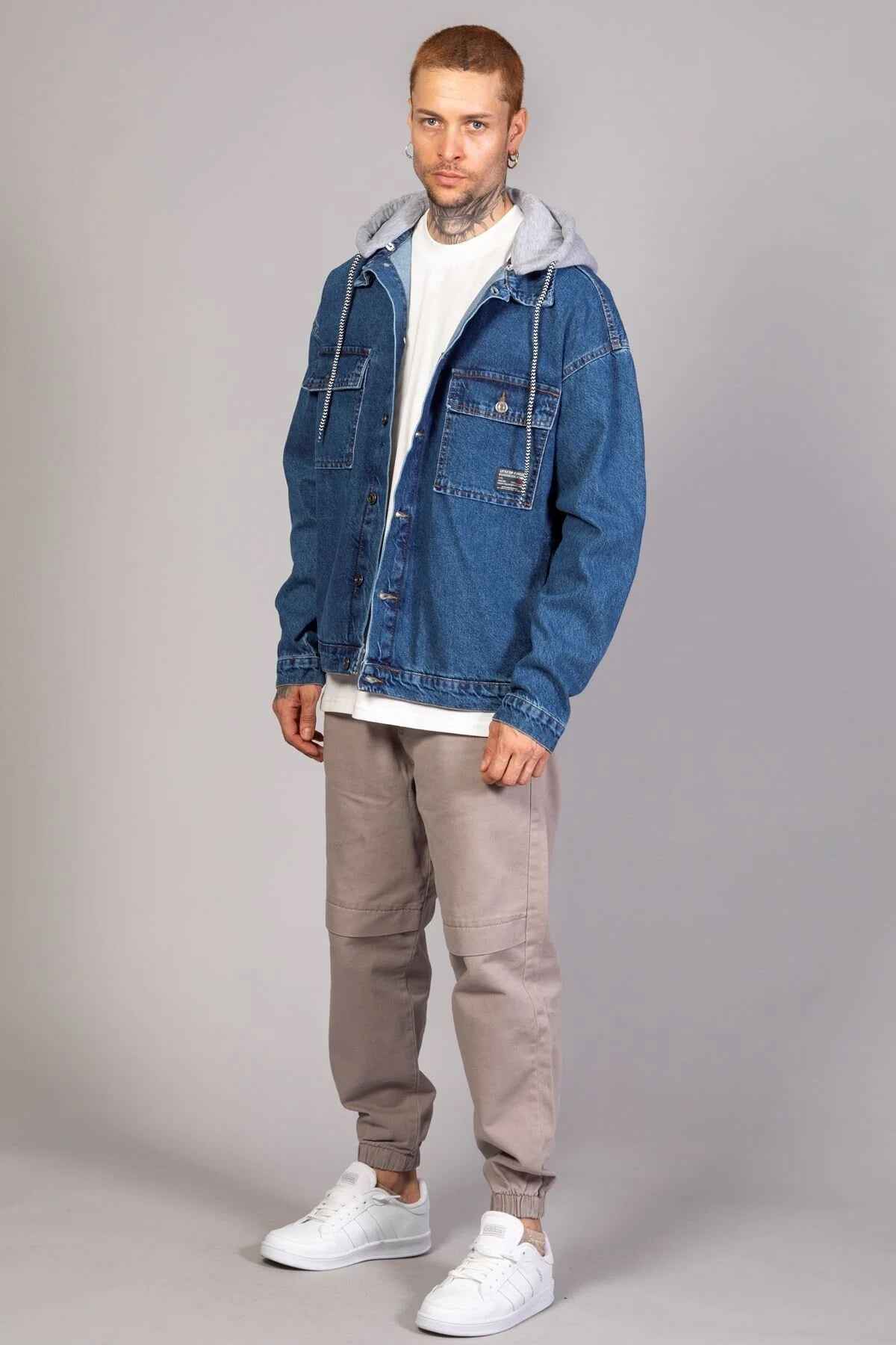 Men's blue oversized denim jacket with gray hood, button front, chest and sleeve pockets