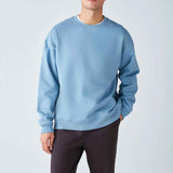 Men's oversized light blue sweatshirt with crew neck, relaxed fit and ribbed cuffs