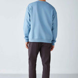 Men's oversized light blue sweatshirt, back view with crew neck and ribbed cuffs