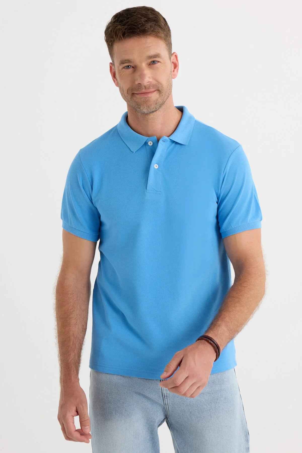 Men's blue polo shirt with short sleeves, button placket, and ribbed collar