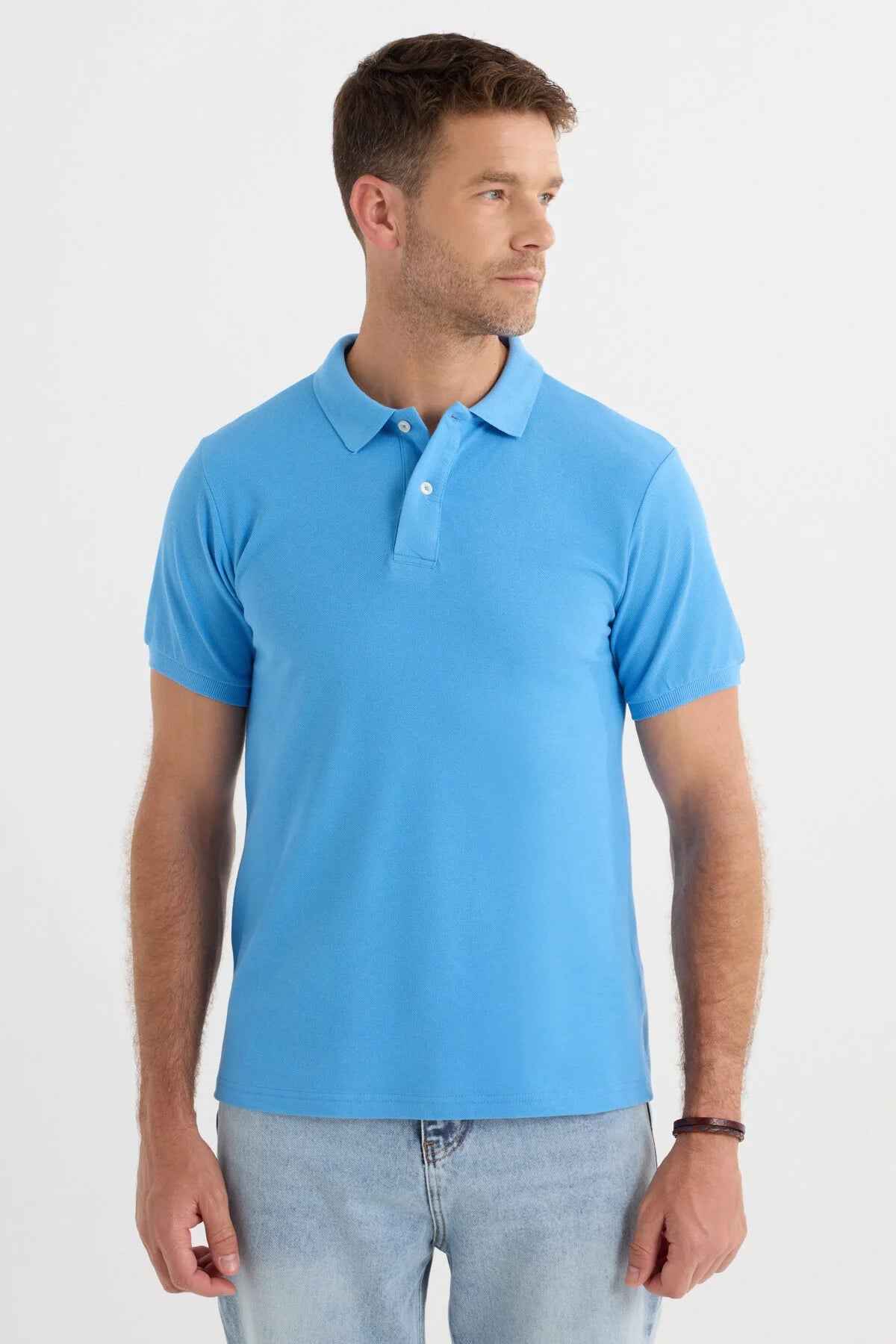 Blue polo shirt side view with short sleeves and button placket