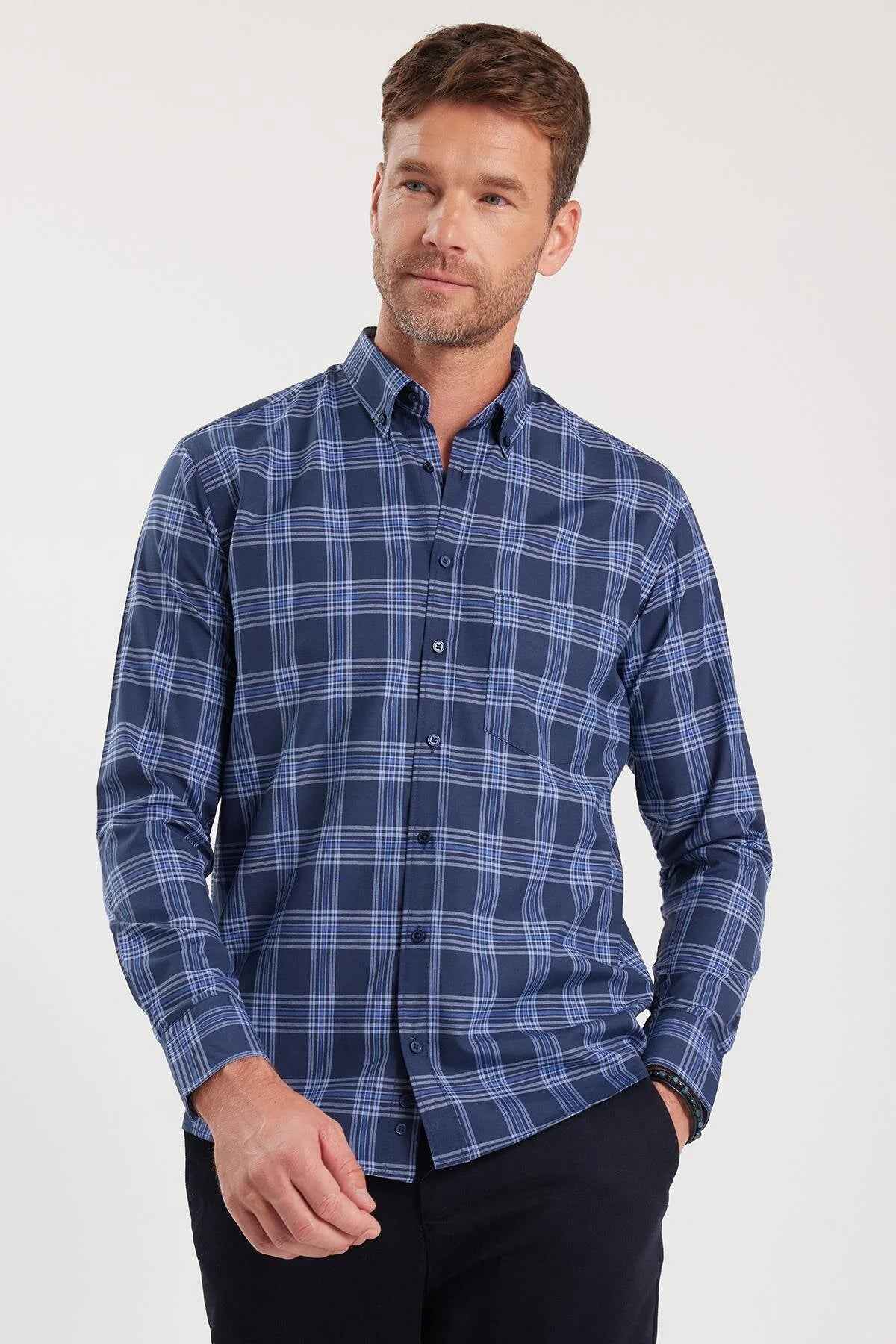 Men's blue plaid button-up shirt with long sleeves and button front detail.