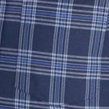 Blue plaid shirt pocket panel with stitched seam and fabric texture.