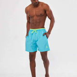 Men's blue swimming shorts with yellow drawstring and elastic waistband, side view